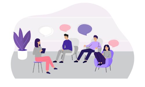 Doctor counseling people at group therapy